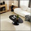 Table basse elliptique en forme de pierre Lucky, conception minimaliste moderne avec base sculpturale pour les salons et les appartements