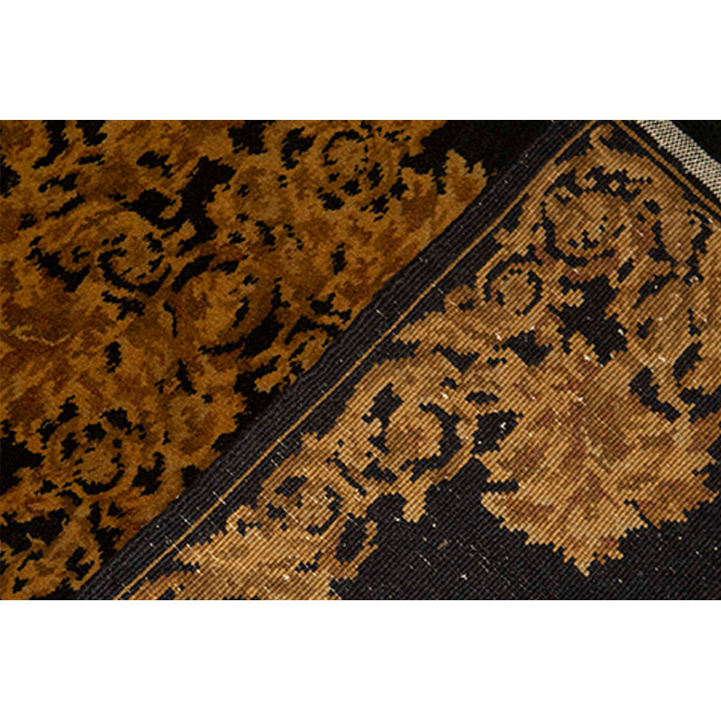 Tapis noir et doré de haute qualité noué à la main