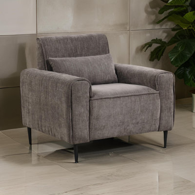 Chaise moderne avec pieds en métal et coussin décoratif