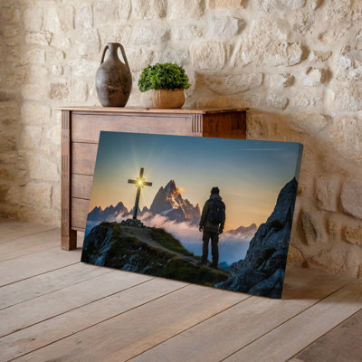 Canvas A Solitary Figure Stands On A Narrow Rocky Path Leading Wall Art Towards A Radiant Cross Illuminated By The Golden Light Of Canvas Wall Art