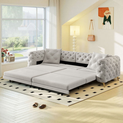 Canapé-lit convertible 3 en 1 de 248 cm de large, format king, en velours, avec capitonnage et coussins.