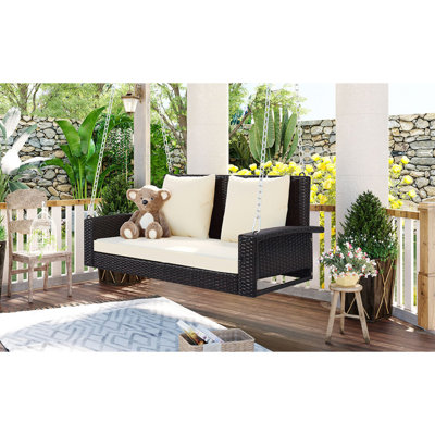 Banc de balançoire en osier avec coussin pour cour arrière