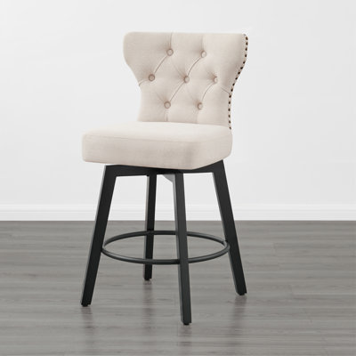 Tabouret de comptoir pivotant et capitonné
