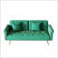 Luxueux canapé-lit en velours vert avec garniture cloutée et coussin décoratif assorti pour un confort élégant