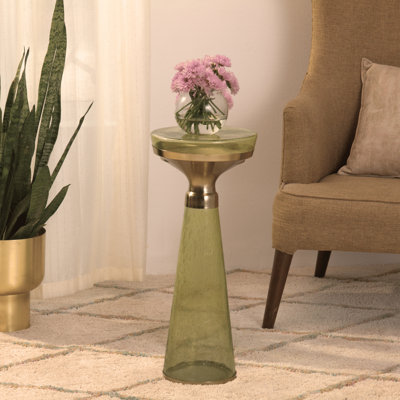 Table ronde moderne avec base en verre et plateau en métal doré
