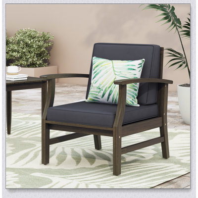 Fauteuil club confortable en bois d'acacia avec coussin résistant à l'eau pour la détente et l'élégance