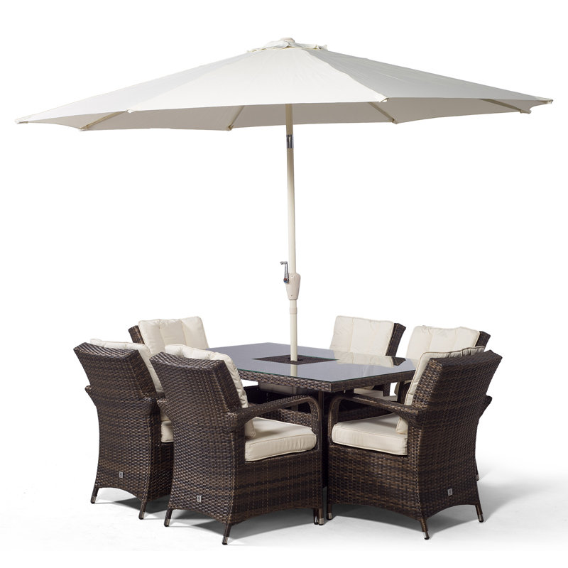 Karas 6 - Person Wicker Patio Dining Set with Rectangular Table , Cushions Included, Brown