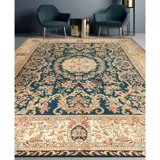 Hand Knotted Wool Oriental Area Rug in Green And Ivory