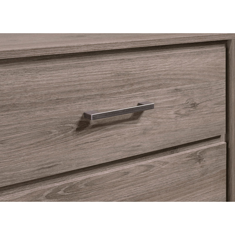 Commode de rangement contemporaine à 4 tiroirs avec poignées en métal et finition chêne gris, parfaite pour les espaces de vie organisés et élégants.