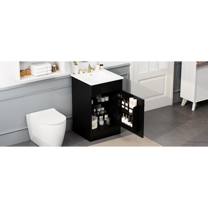 Meuble-lavabo noir de 50 cm avec vasque. Armoire à panneaux, tablette de porte et tablette intérieure réglable. Vasque en céramique lisse et imperméable. Vasque à charnières, noire. Armoire à utiliser. Revêtement teinté pour la vasque.