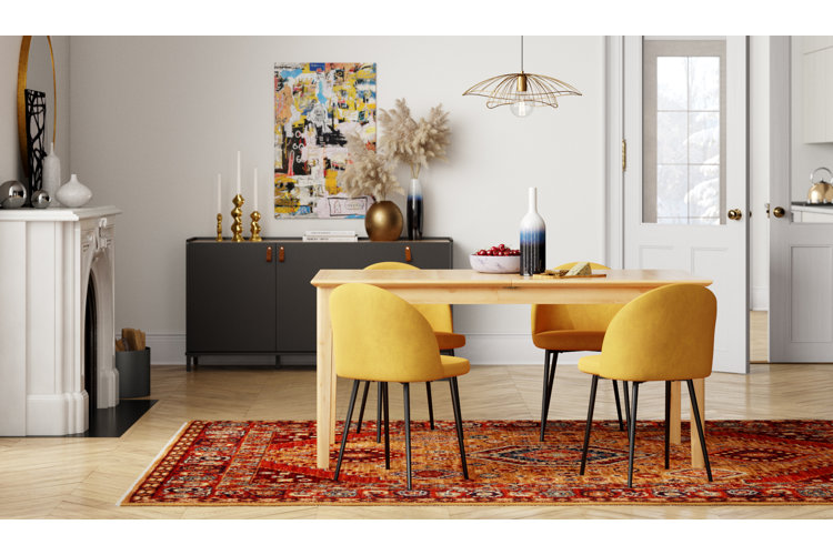 modern dining room with a four-person dining table over a red Oriental rug