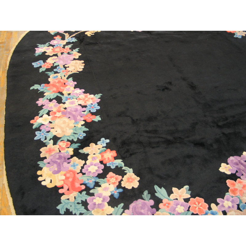 Tapis ovale noir en laine noué à la main à motif floral des années 1920