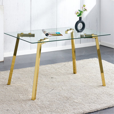 Table de salle à manger rectangulaire avec plateau en verre trempé et pieds en métal doré, look minimaliste moderne pour meuble
