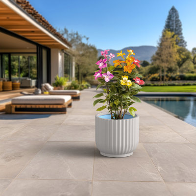 Pot à fleurs moyen rond en béton avec trous de drainage