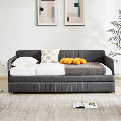 Lit de jour simple avec lit gigogne et lit en fer gris pour un espace de vie moderne
