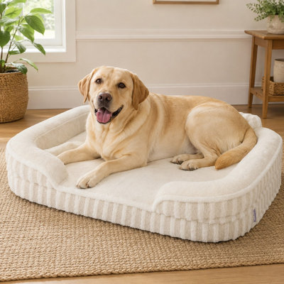 Beige 42" XL high-back orthopedic dog couch with sides, waterproof construction, egg-crate foam, a removable washable cover, and non-slip bottom, styled as a cozy home-decor pet bed.