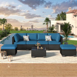 Emilienne 7 Piece Rattan Sectional Seating Group with Cushions