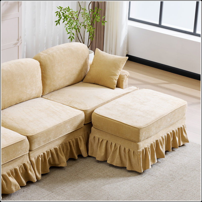 Canapé d'angle moderne en chenille d'une forme en L avec jupe à volants amovible et pouf pour un confort optimal dans votre salon