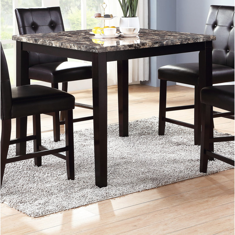 Table de salle à manger moderne moderne avec plateau en faux marbre foncé et placage de bouleau