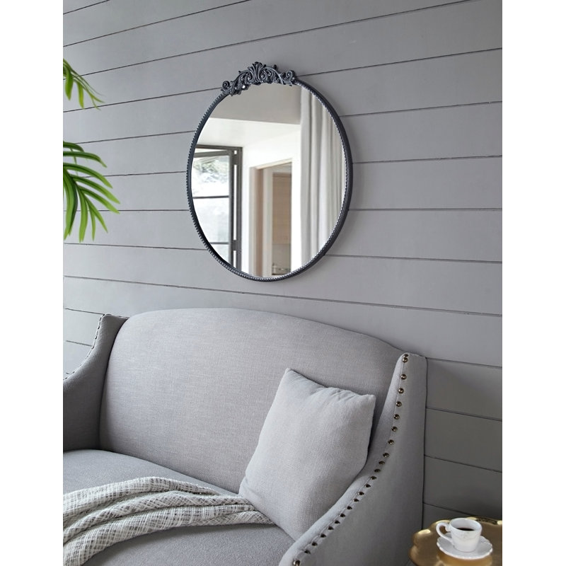 Miroir avec forme ronde et cadre d'inspiration baroque