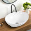 Lavabo de salle de bain ovale en céramique blanche et trop-plein