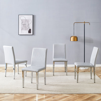 Quatre chaises de salle à manger en polyuréthane gris clair (seulement les chaises)