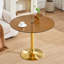 Table ronde en verre brun clair de luxe avec pied en métal doré, idéale pour les petits espaces de salle à manger et de salon.