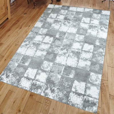 Tapis rectangulaire gris en polypropylène tissé à plat à la machine Margarida