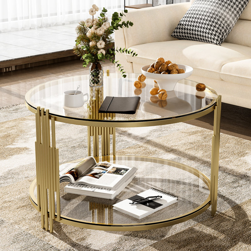 Table basse moderne en verre trempé, structure en métal asymétrique, base tambour doré, tablette inférieure pour plus de fonctionnalité et de style,