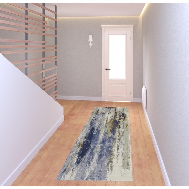 Tapis bleu, orange et ivoire