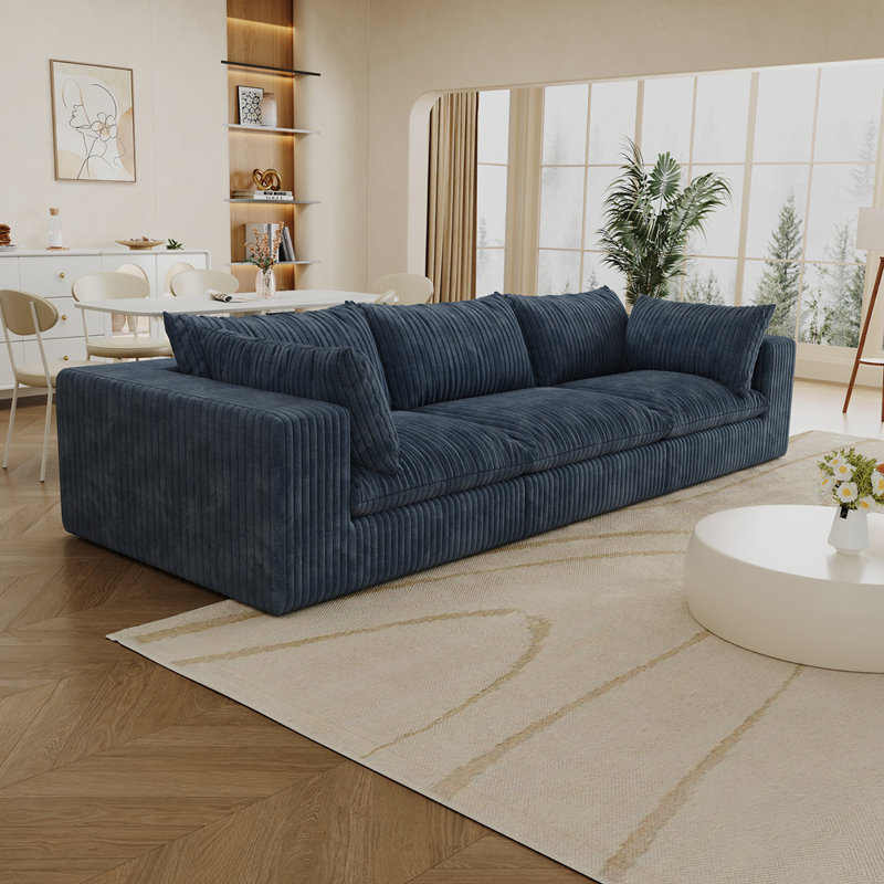 Luxueux canapé modulaire rembourré de plumes avec un tissu doux et une éponge haute densité, parfait pour une assise polyvalente et confortable.