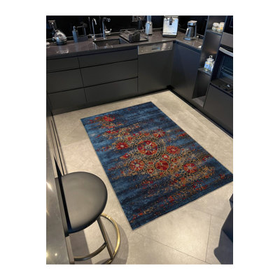 Tapis bleu décoratif abstrait à motif floral