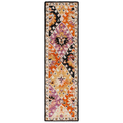 Fredick Tufted Wool/Cotton Southwestern Rug in Yellow/Black/Pink