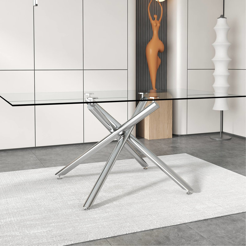 Table rectangulaire moderne avec pieds en verre trempé et en métal argenté pouvant accueillir 4 à 6 personnes, ajoutant du style à la décoration intérieure
