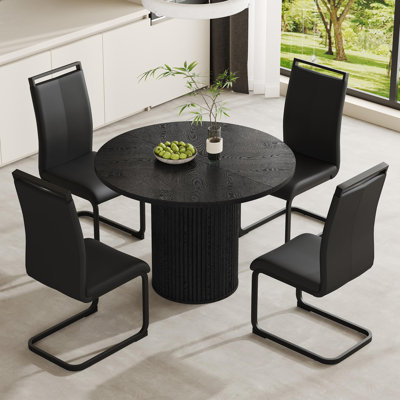 Ensemble de table de salle à manger 5 pièces comprenant un plateau en bois noir et une base cylindrique. Ensemble de table de salle à manger 42 po pour 4 personnes alliant stabilité, confort et style contemporain.