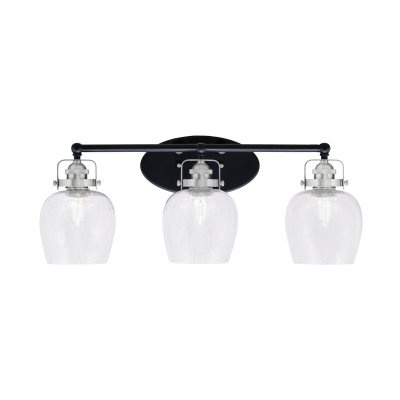Applique murale Easton à 3 lumières, offerte en noir mat et nickel brossé, avec verre bullé transparent de 15 cm.