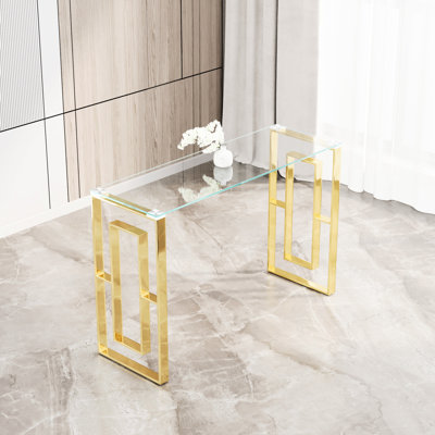 Console en acier inoxydable doré, combinaison de verre transparent avec patin sur pieds et plateau en acier
