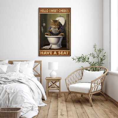 Chat dans la toilette avec siège