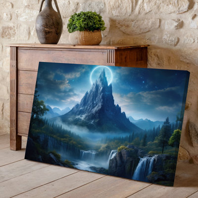 Toile, "Un paysage mystique" avec un imposant sommet de montagne dentelé illuminé par un anneau céleste fixé contre une toile sombre