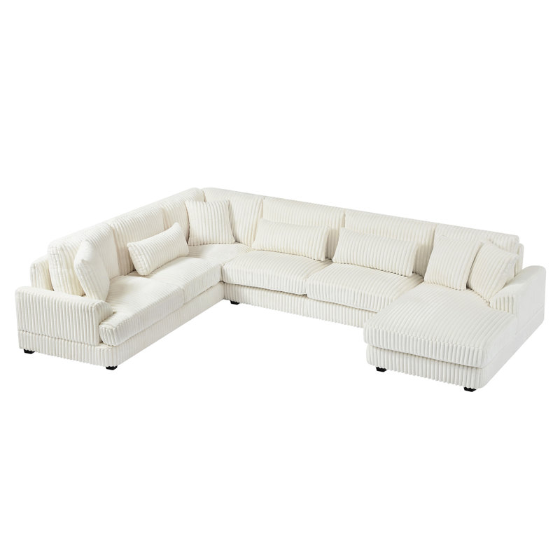Canapé confortable rembourré en velours côtelé beige avec méridienne et structure en U doux