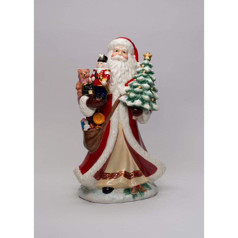 Figurine de père Noël tenant des jouets