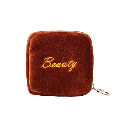 The Zipper Of The Cute And Super Mini Wrist Bag Contains The Lipstick