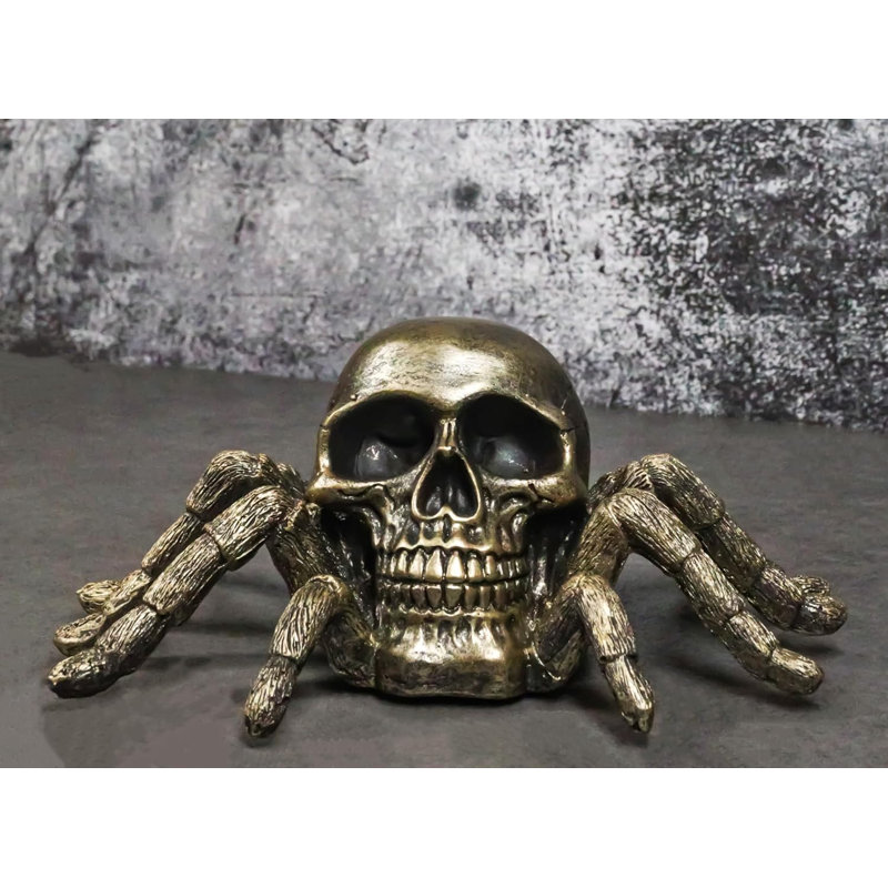 Figurine de crâne de faux araignée