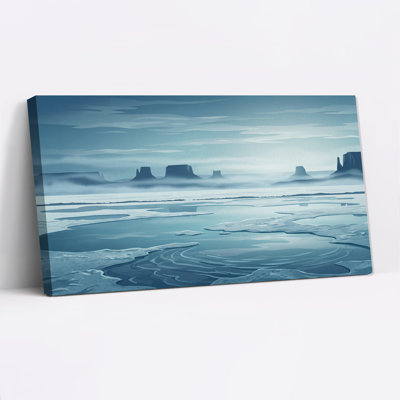 Blue Ice Covered Water with Misty Rock Formations Canvas Wall Art