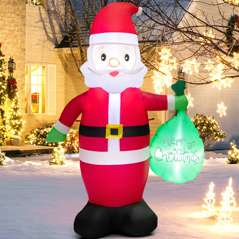 Père Noël tenant un sac-cadeau avec lumières DEL gonflables
