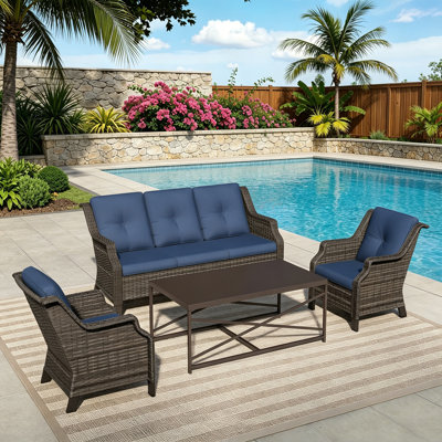 4-Piece PE Wicker Patio Conversation Set with 3-Seat Sofa,2 Chairs,Coffee Table & Blue Cushion