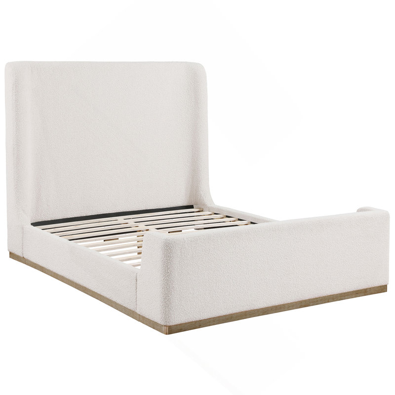 Lit-bateau tapissier luxueux avec base en bois exposée, offrant confort, style et durabilité pour une chambre à coucher relaxante