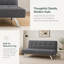 Mobilier gris pliant en tissu à double usage, placé dans le salon, en un clic entre le canapé et le lit