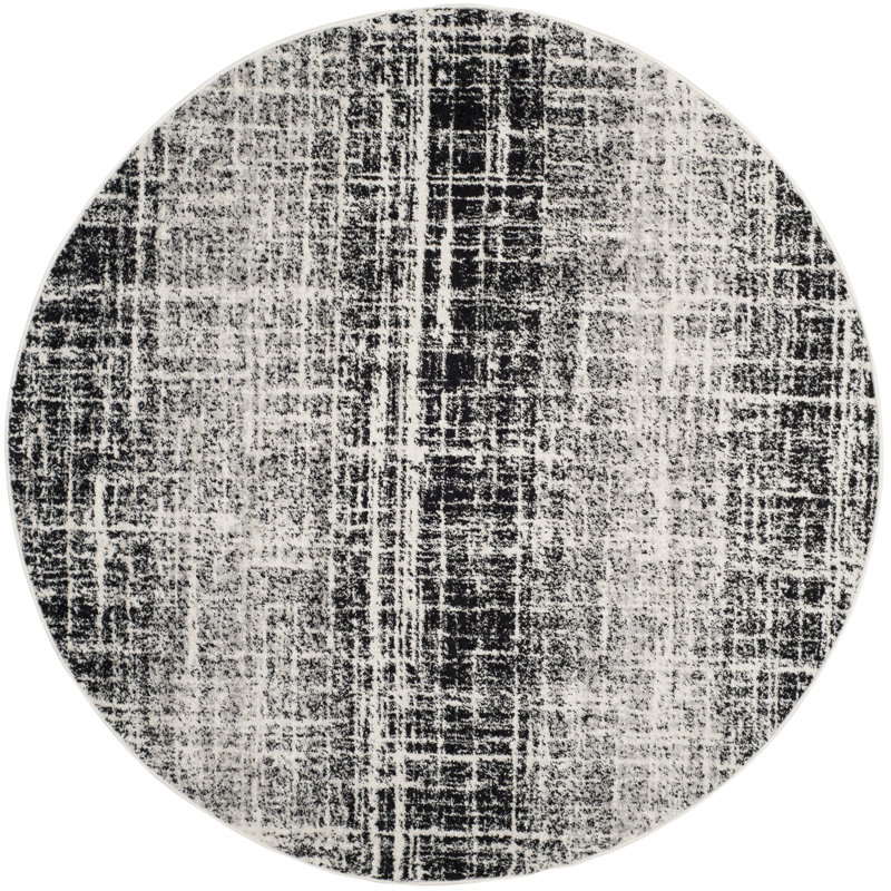 Tapis noir Riebe, Rond 6 pi