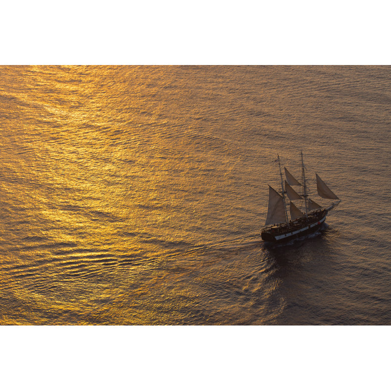 Ship Sailing At Sunset by Elxeneize - Wrapped Canvas Print, 30cm H x 46cm W